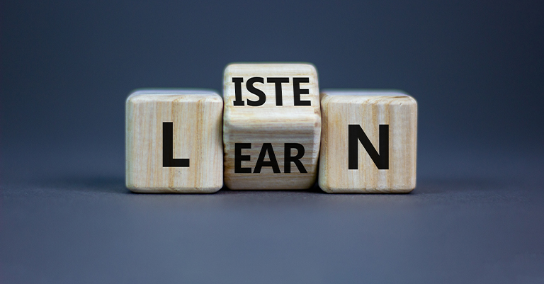 ActiveListen_3 • Roche Leadership Wooden blocks spell out “LISTEN” and “LEARN” combined, symbolizing that listening is a core step in gaining knowledge.